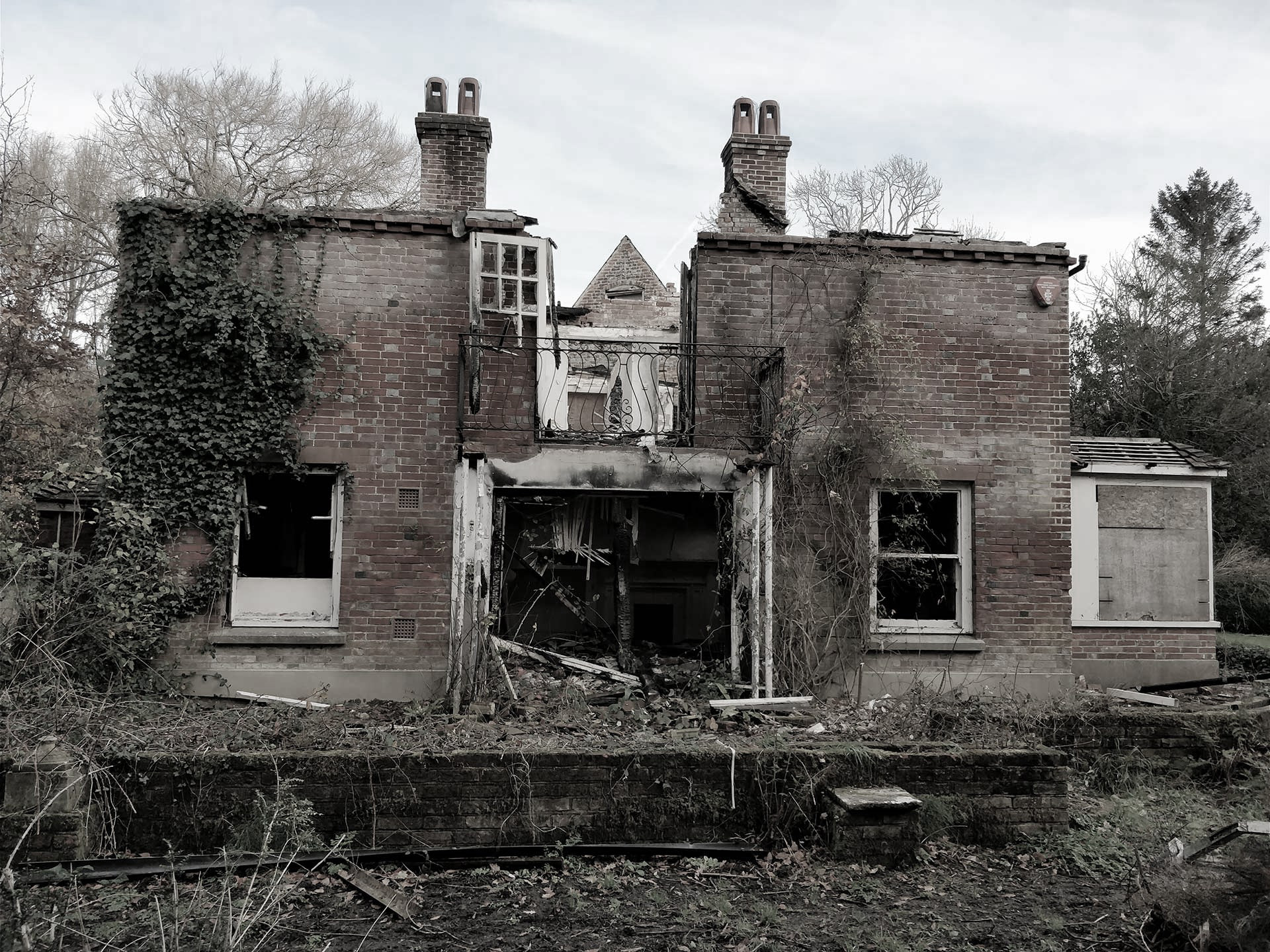 before photo of red brick house in need of restoration