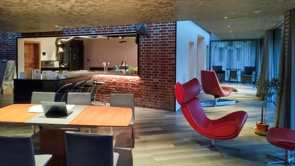 dining area with internal feature brick wall