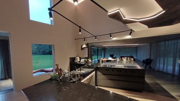 large open-plan kitchen dining room with feature lights in ceiling