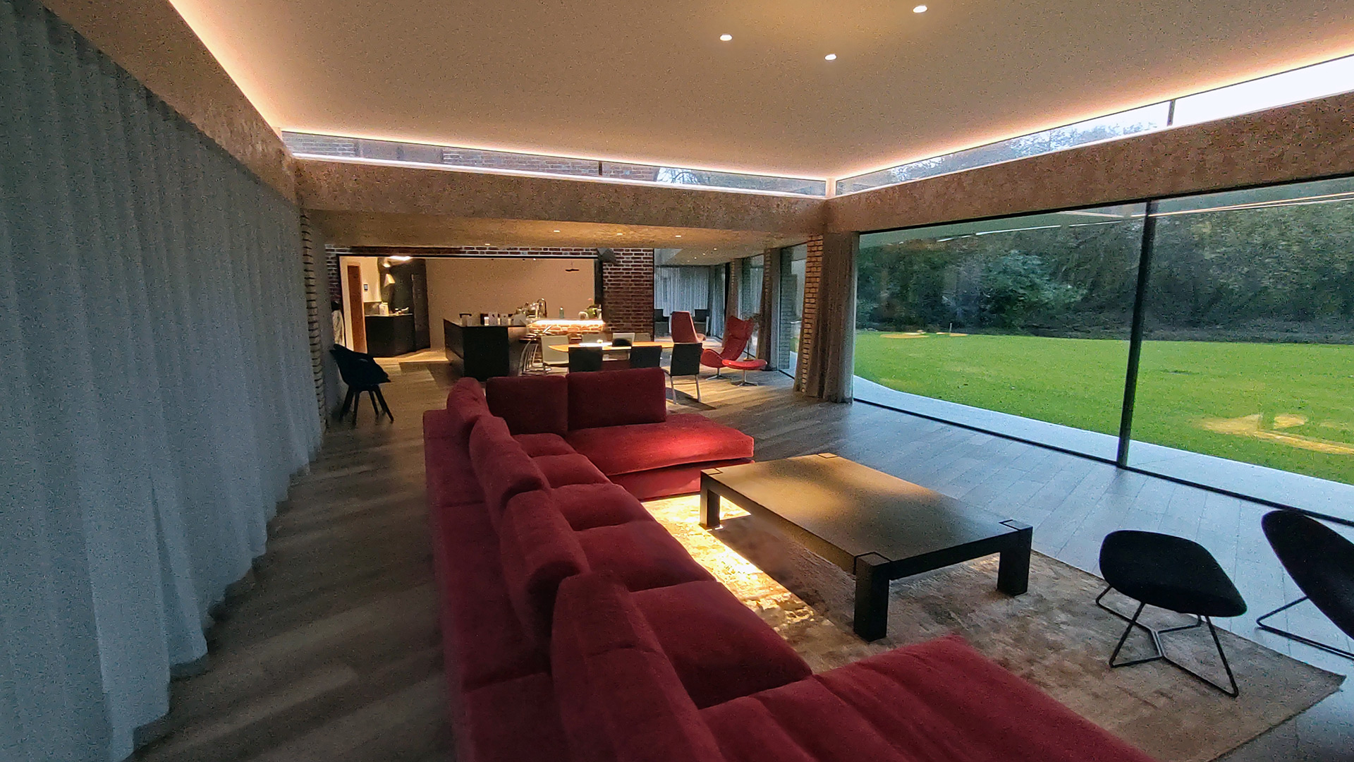 open plan kitchen and dining room with large windows