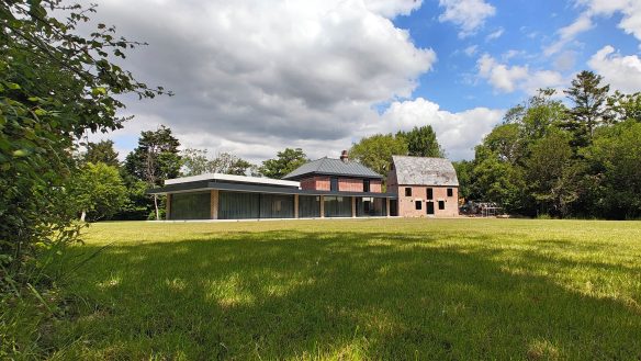 listed red brick building with large contemporary extension