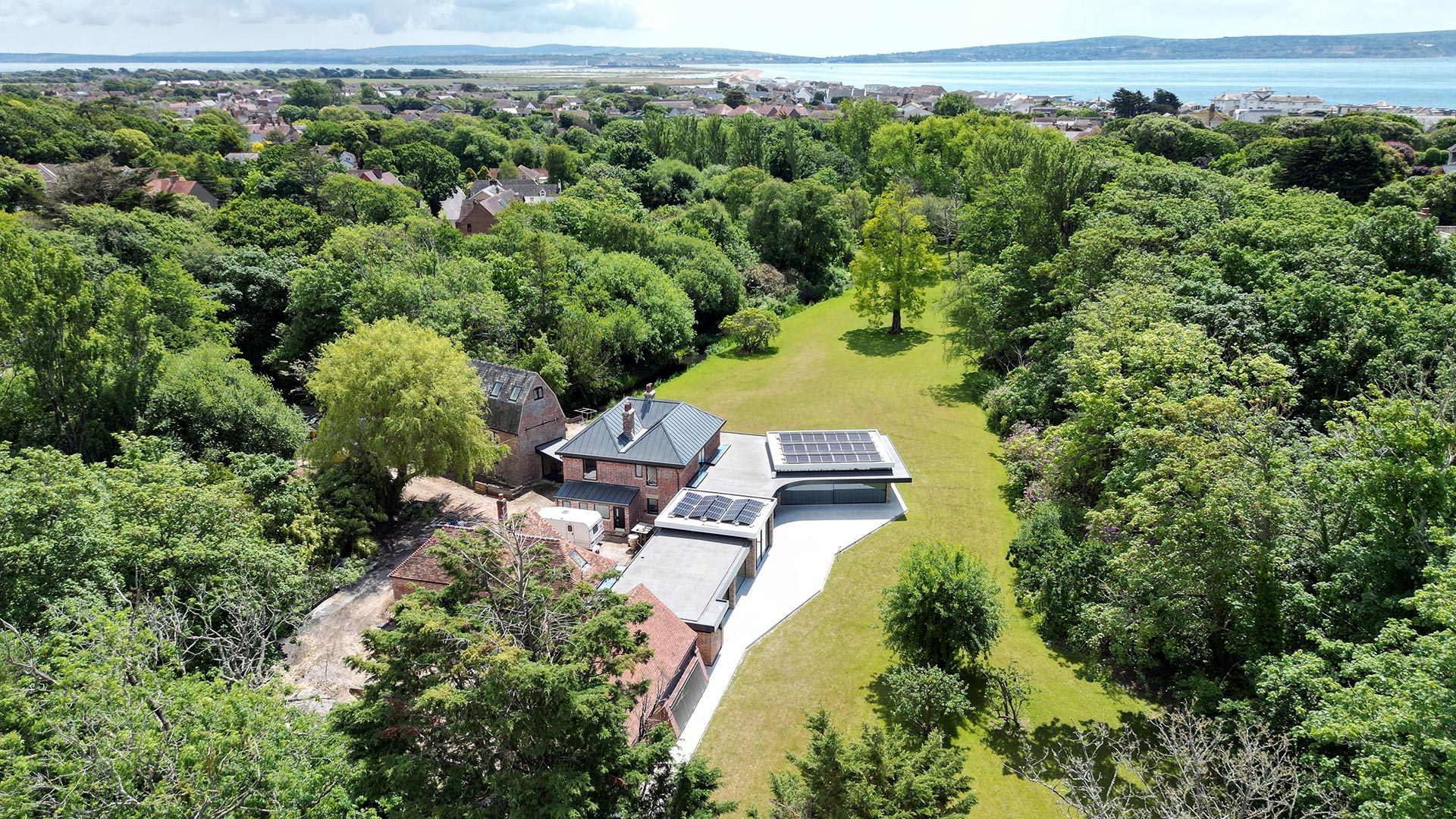 aerial view of listed red brick house with large modern extension