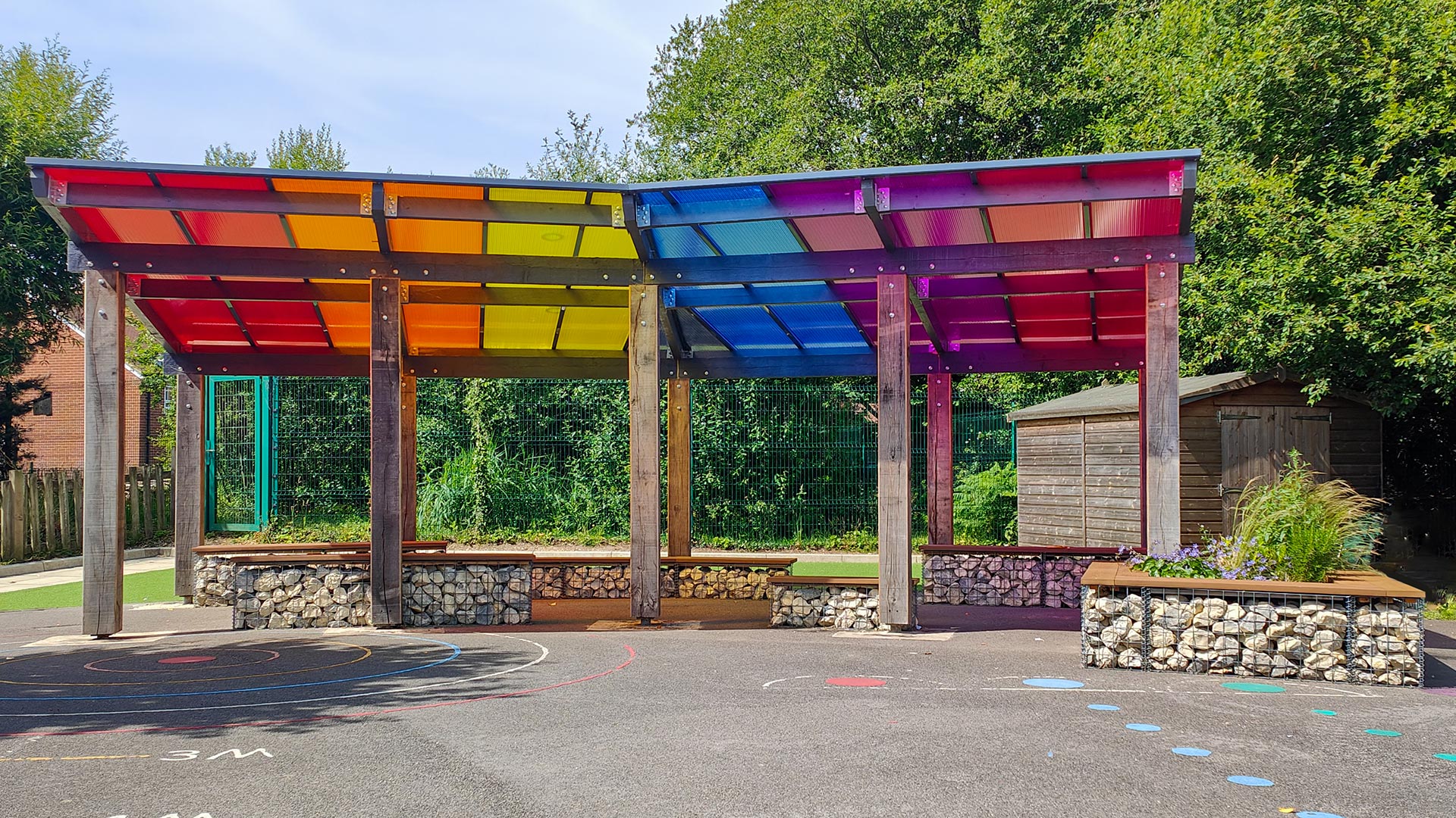 front view of shelter in school playground with multicolored roof