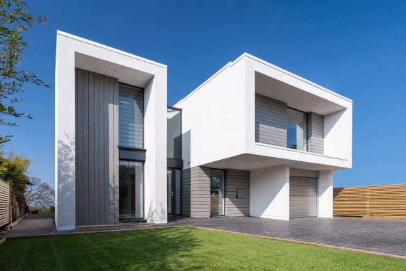 approach view of contemporary house with large driveway