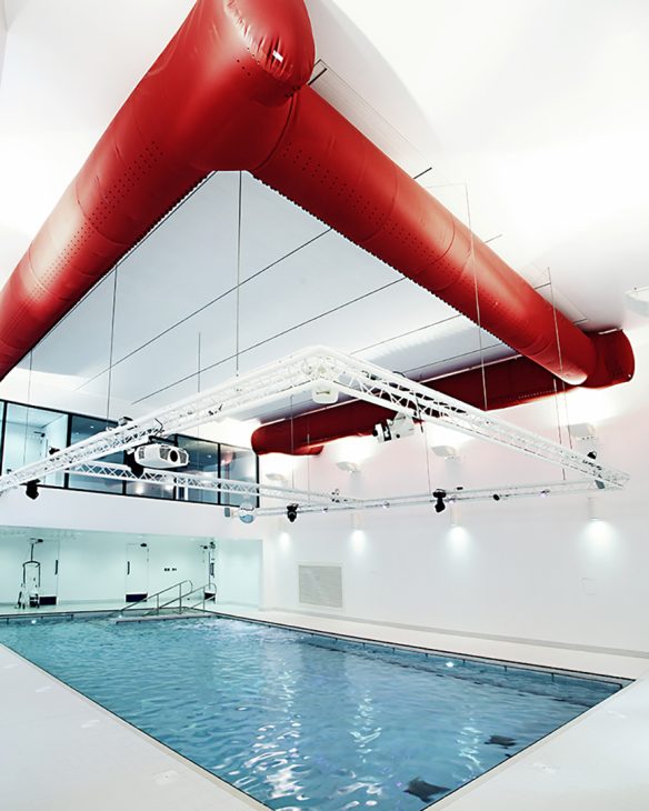 large indoor hydrotherapy pool with accessible steps in far end