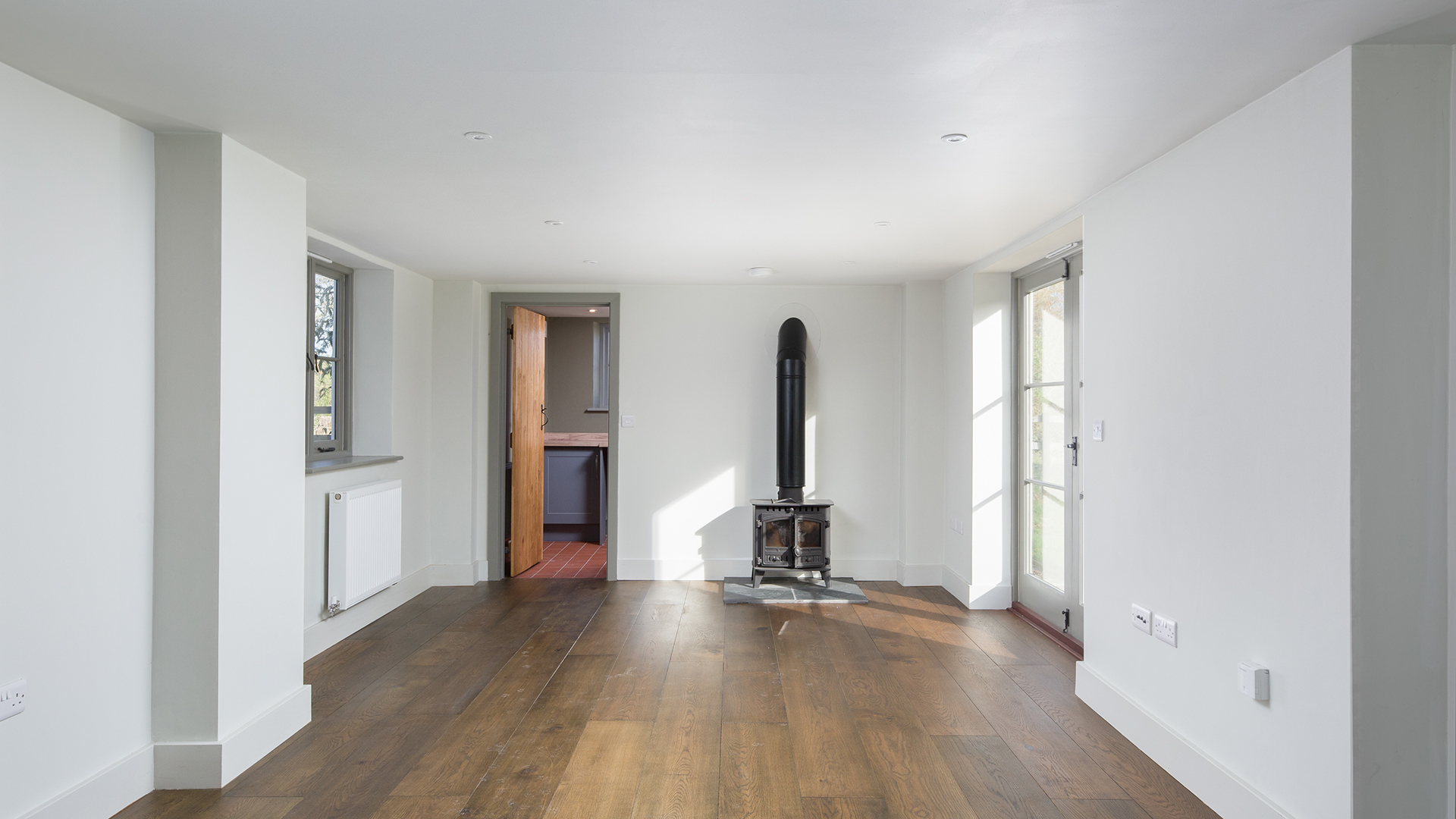 contemporary living area with wood burner