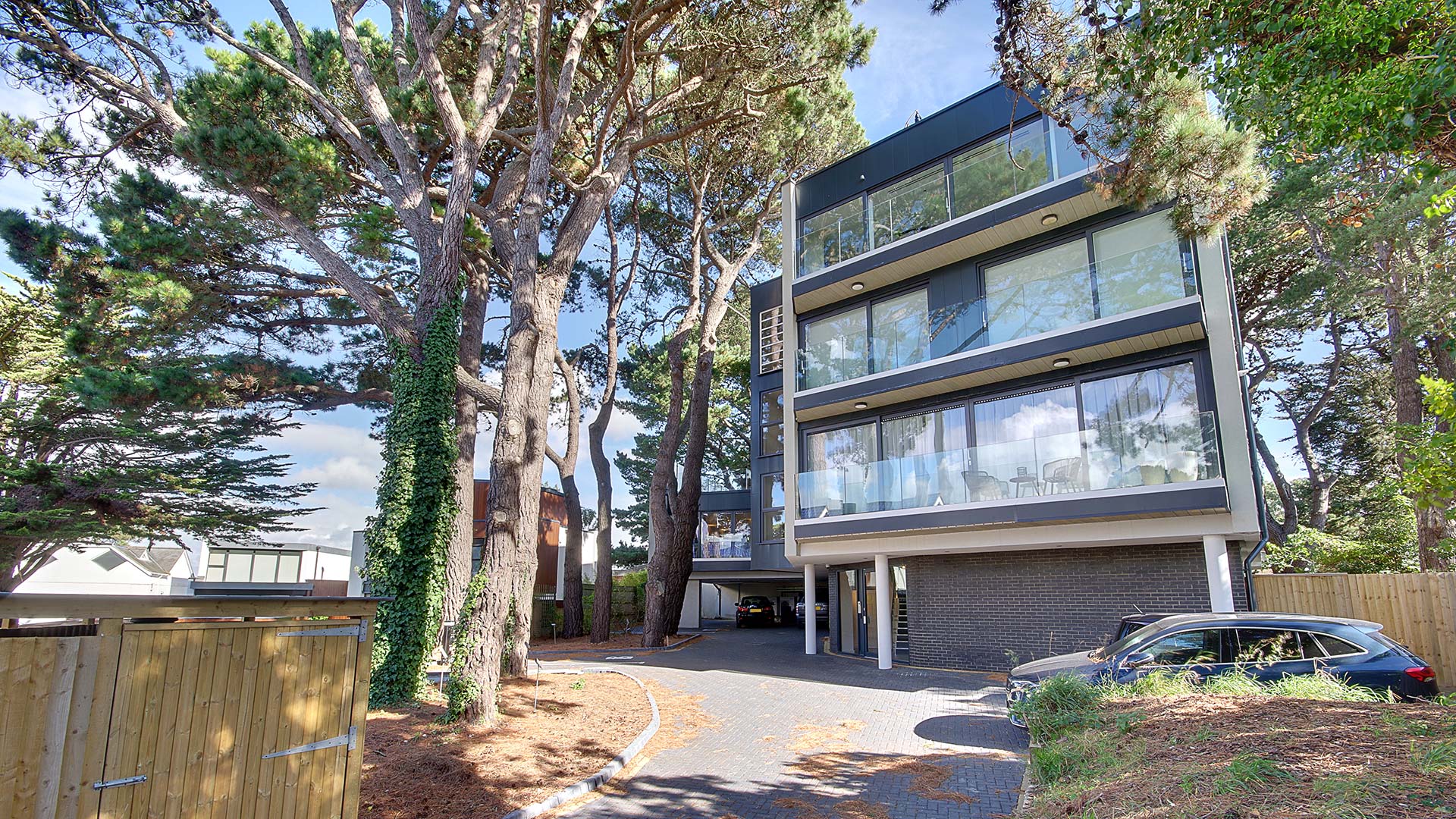 front view of contemporary apartments with driveway