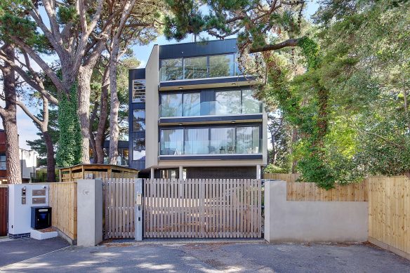 front view of modern apartments with electric gate