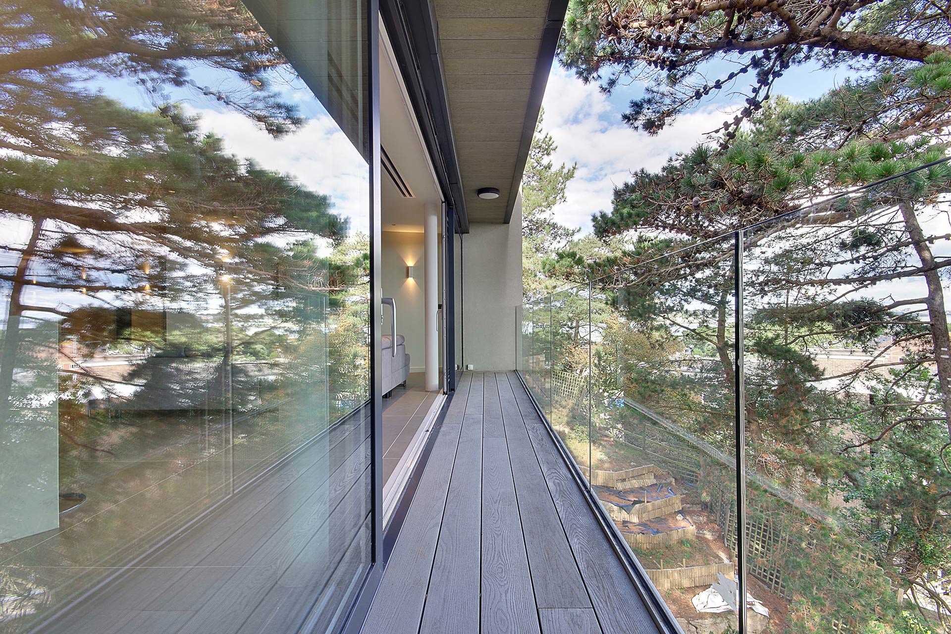 contemporary balcony with glass balustrade