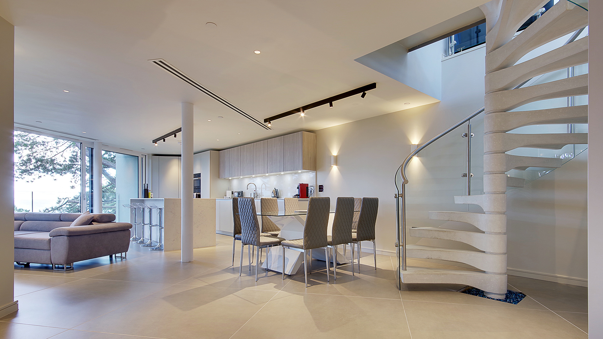 spiral staircase in modern open plan kitchen