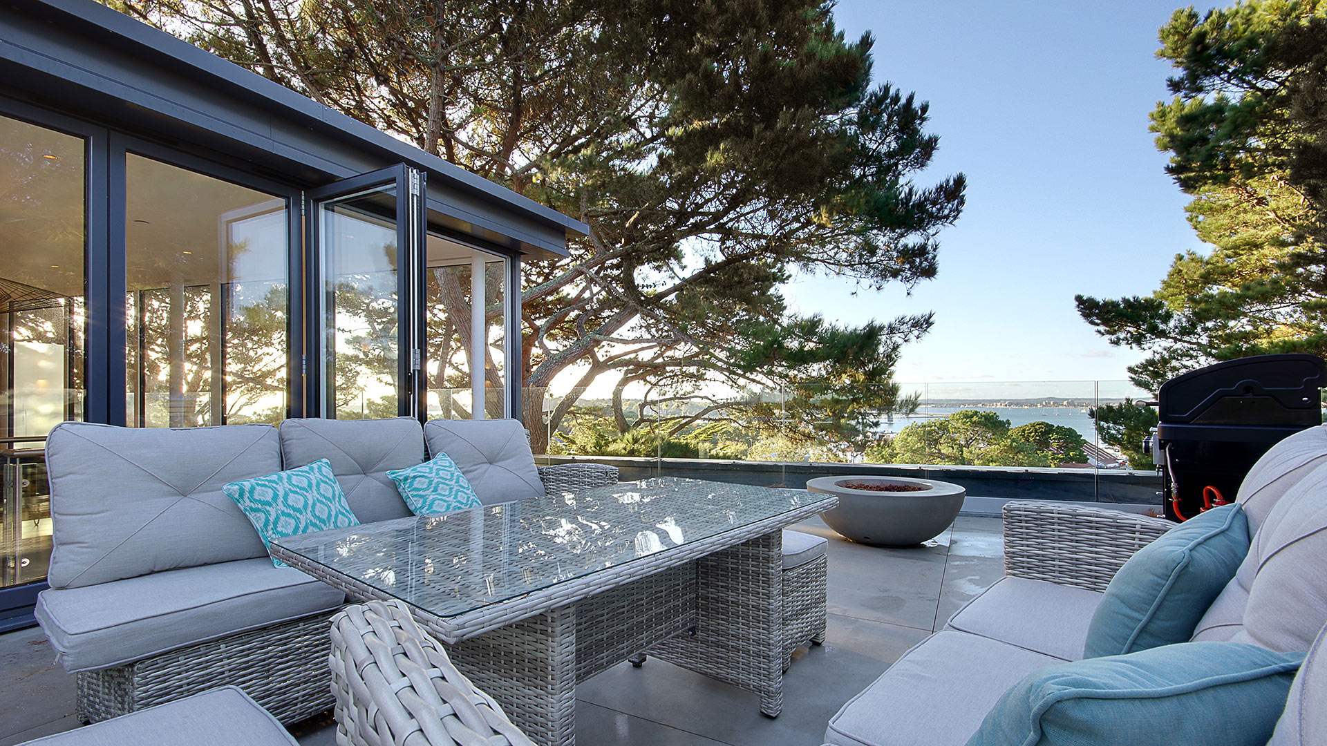 roof top terrace with seating area and glass balustrade with beautiful sea views