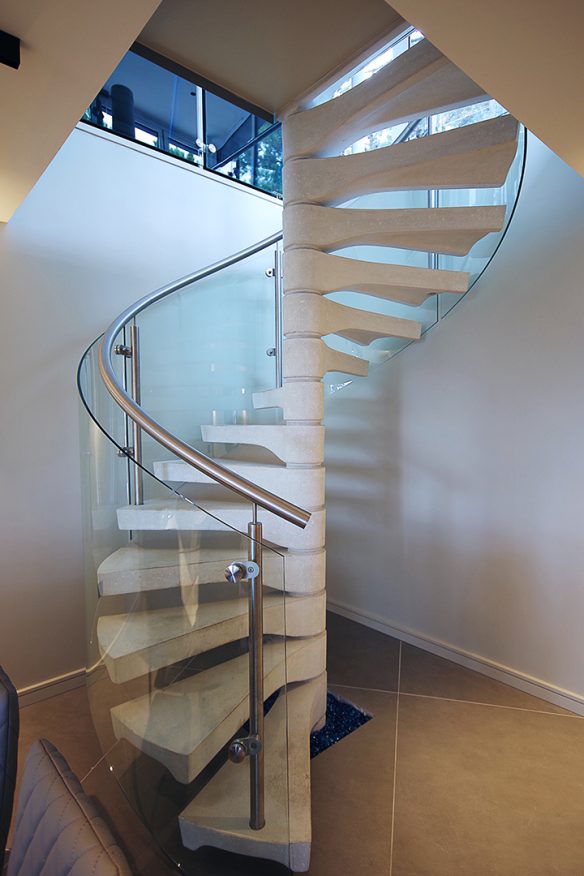 contemporary spiral open-tread staircase with glass balustrade