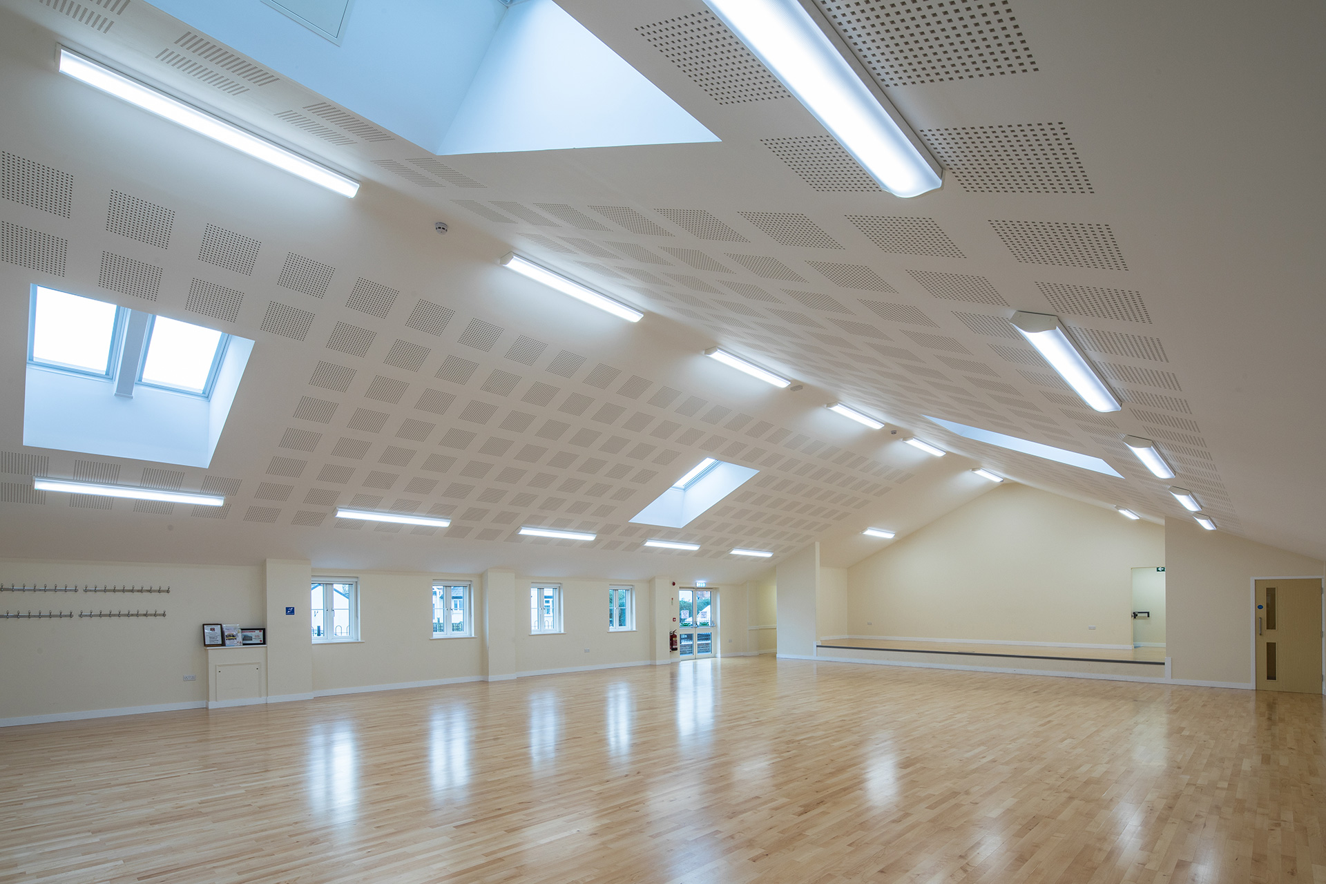 interior village hall area with vaulted ceilings and roof lights