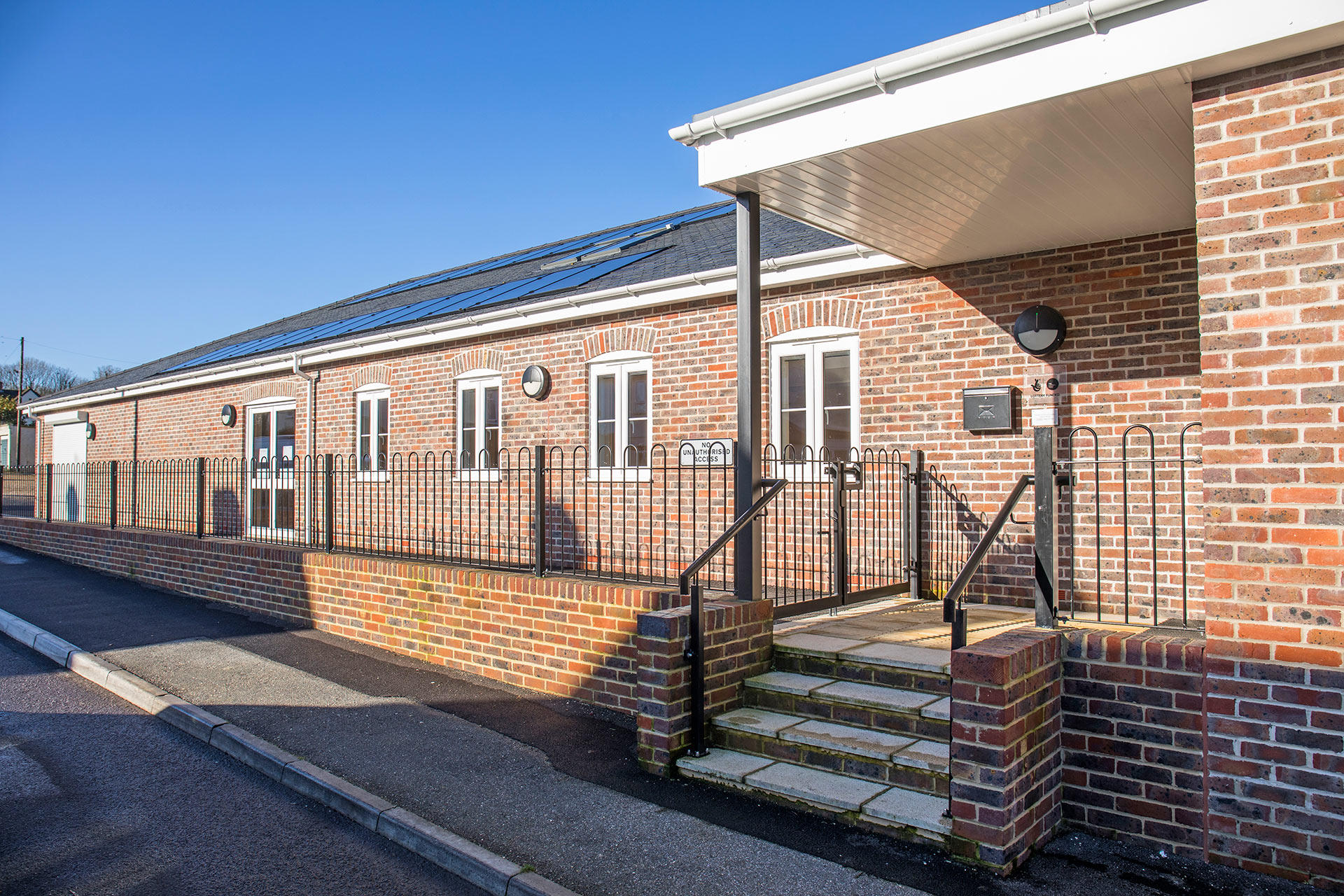 red brick village hall with steps up to entrance