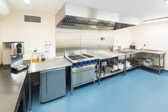 village hall kitchen with silver oven and extractor fans