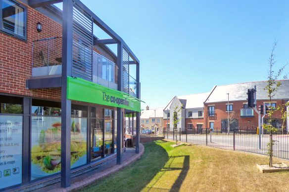 retail shop with curved wall and balcony on first floor