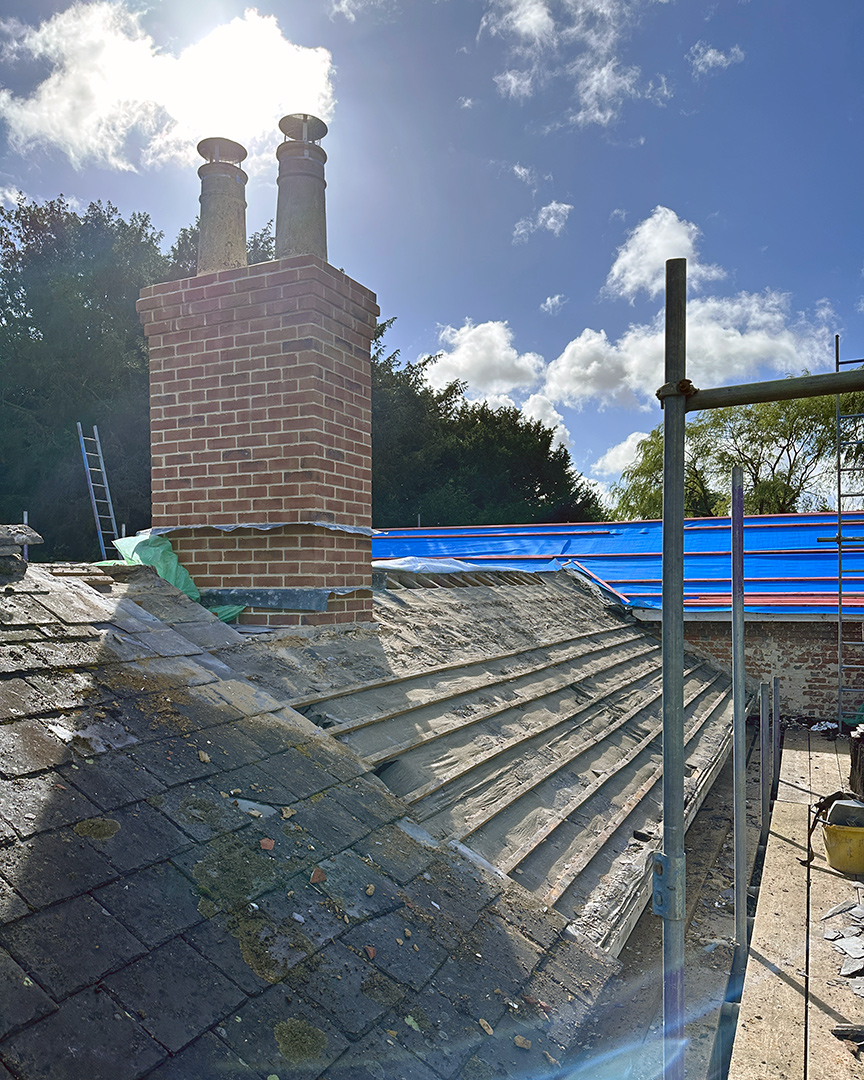 roof renovations with red brick chimney