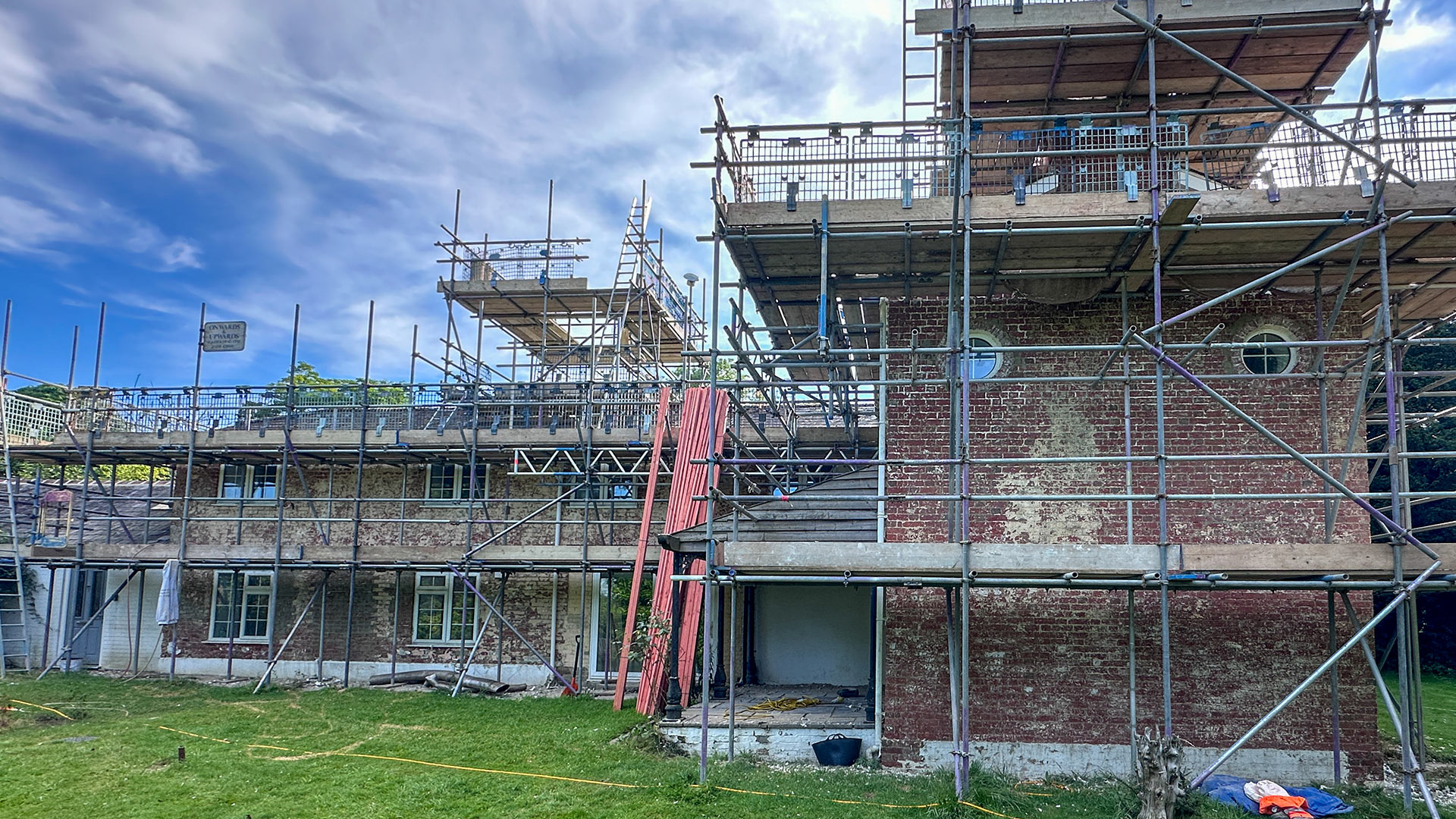 rear view of house renovation with scaffolding