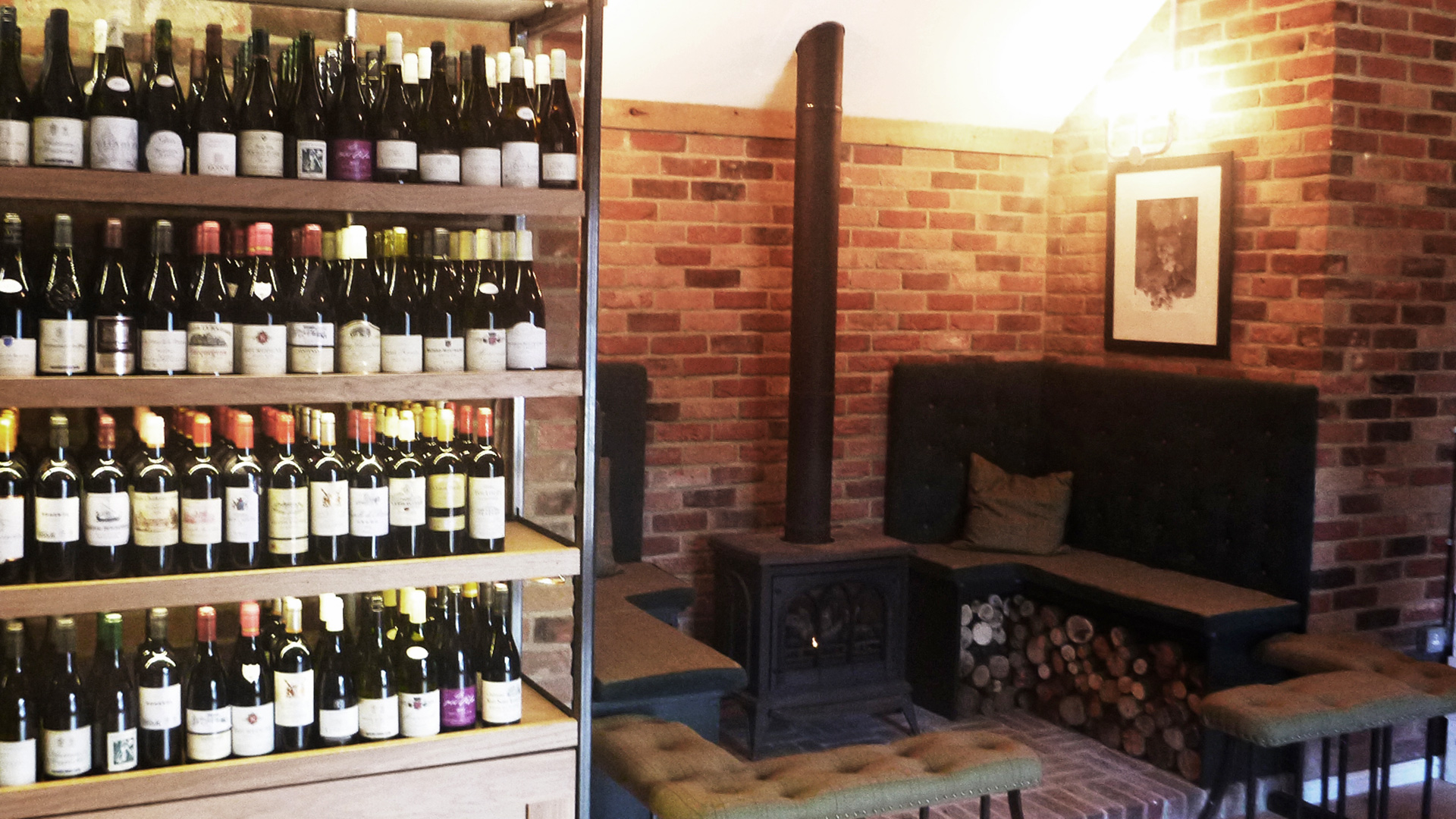 wine bar seating area around wood burning stove