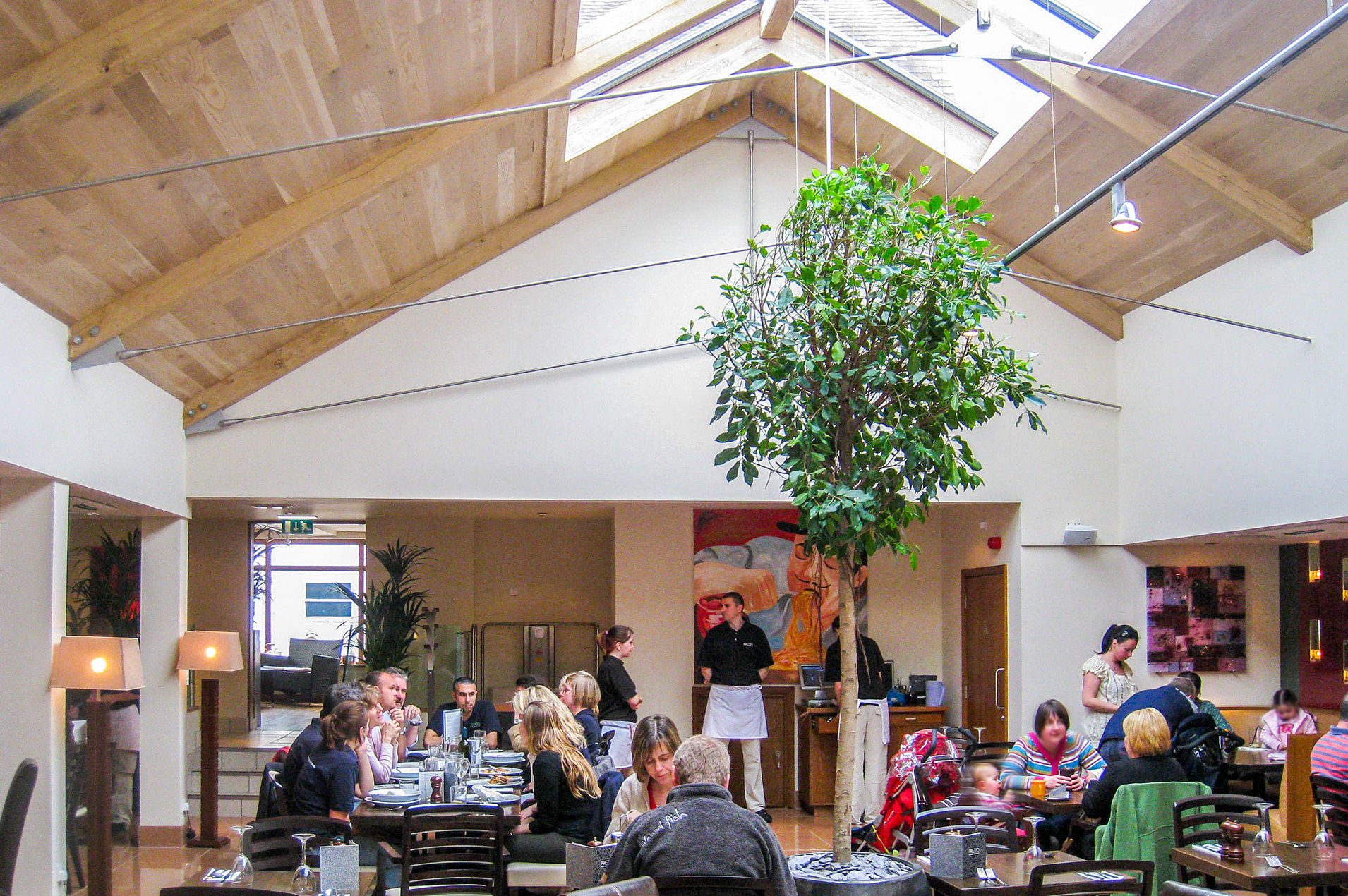 restaurant with vaulted ceilings and skylights