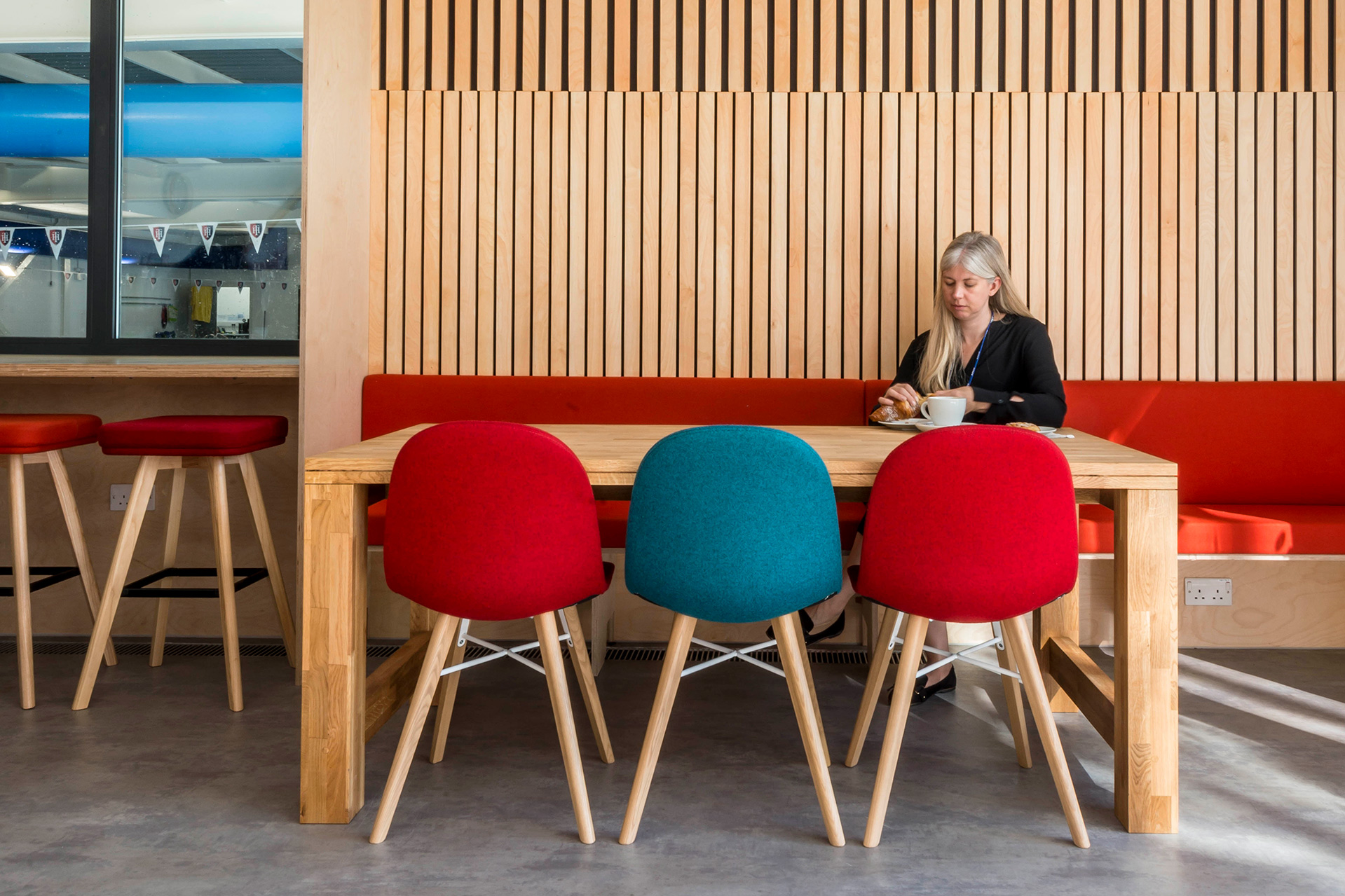 interior cafe seating area with timber cladding on walls