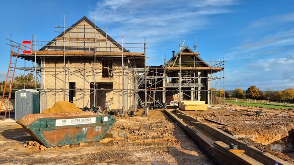 Front view of new house under construction with scaffolding