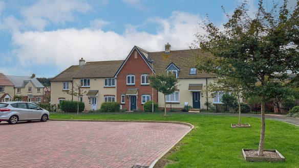 terraced housing with parking spaces in front