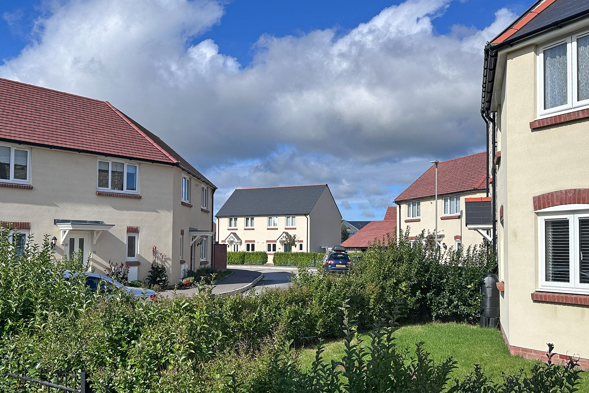 housing development with white houses and tiled roof