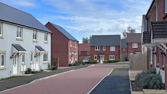 new housing development with red brick road