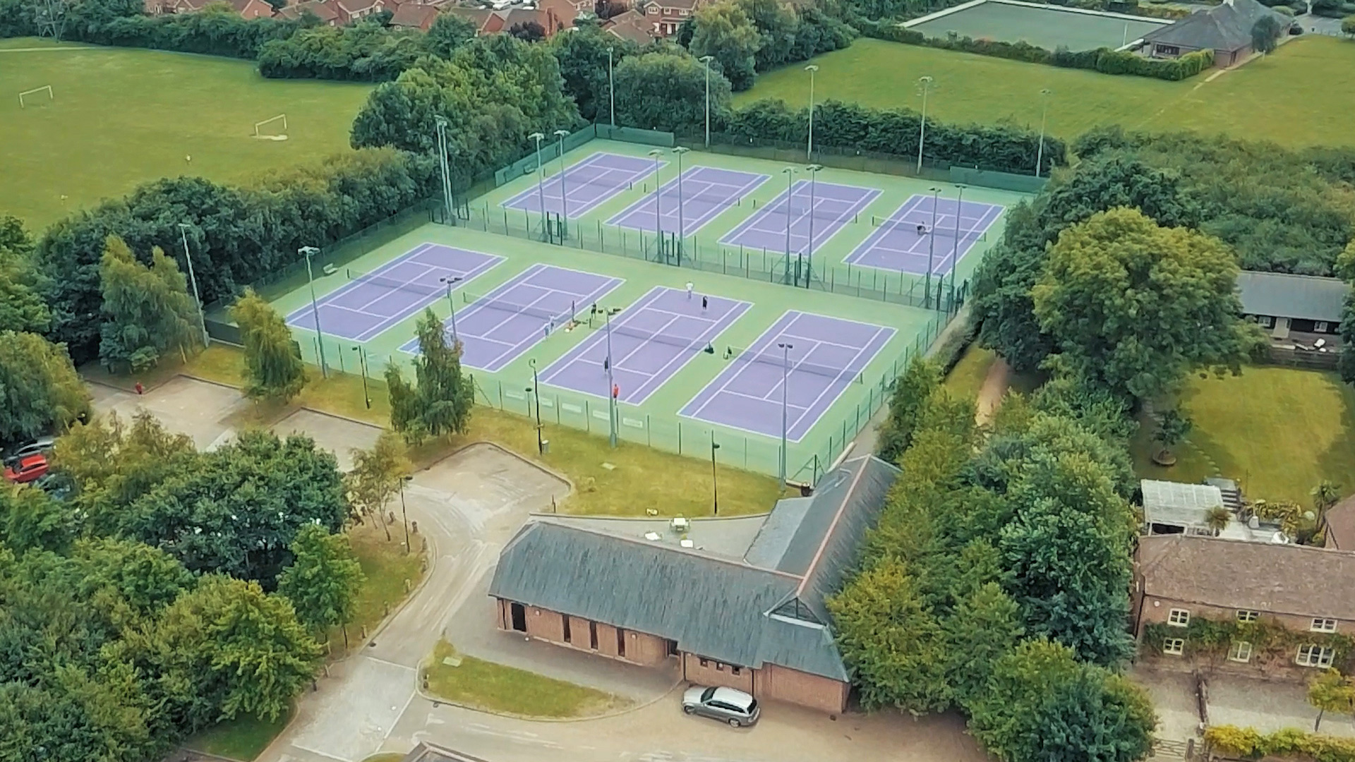 aerial view of tennis courts and sports centre