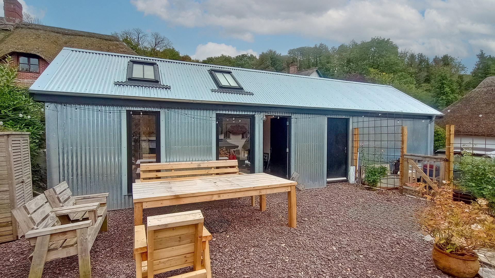 home office annex with metal corrugated roof and walls