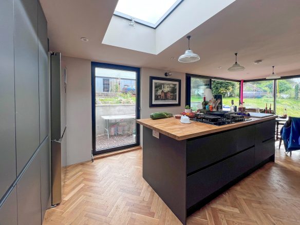 modern kitchen extension with island and skylight