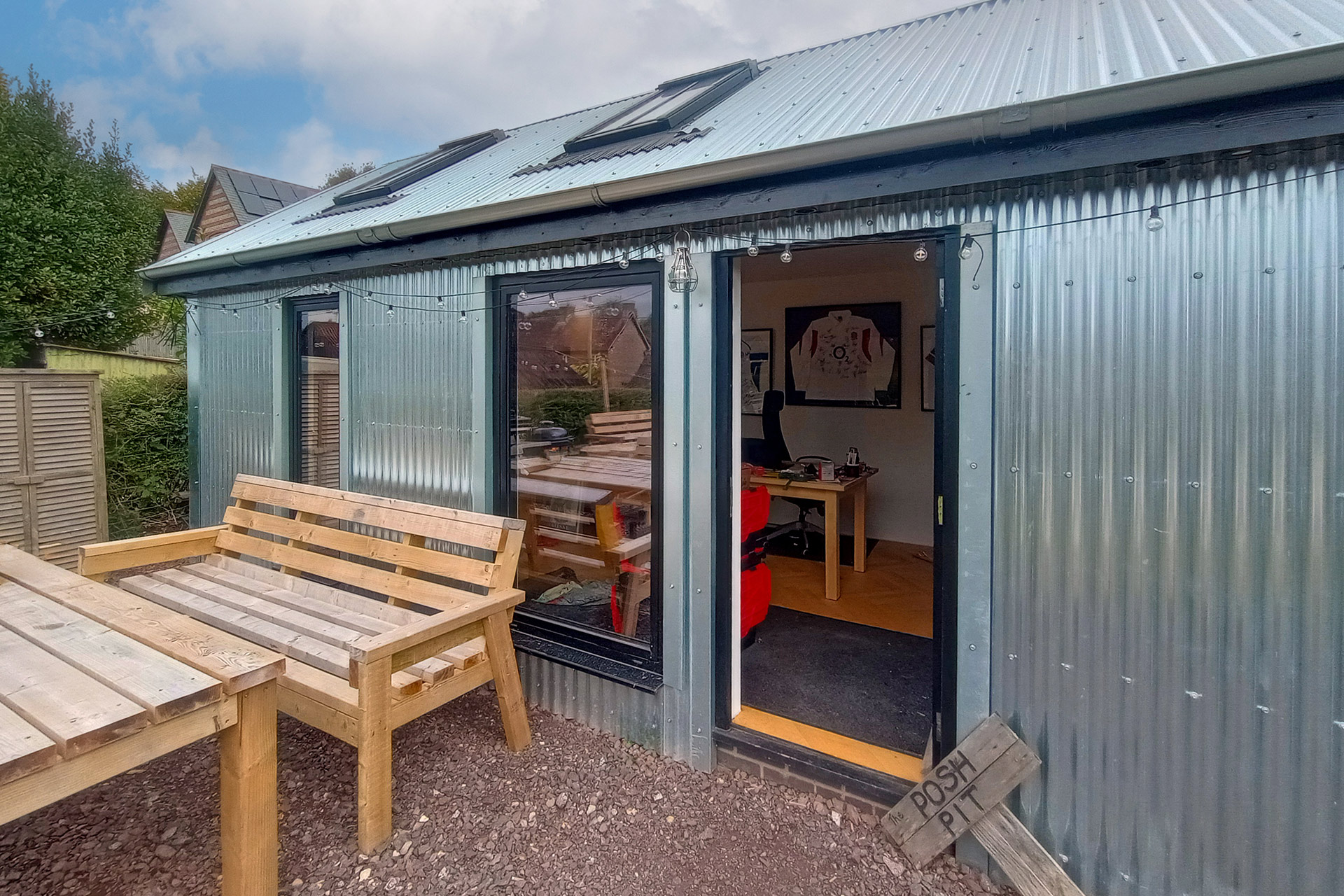 modern corrugated annex in garden