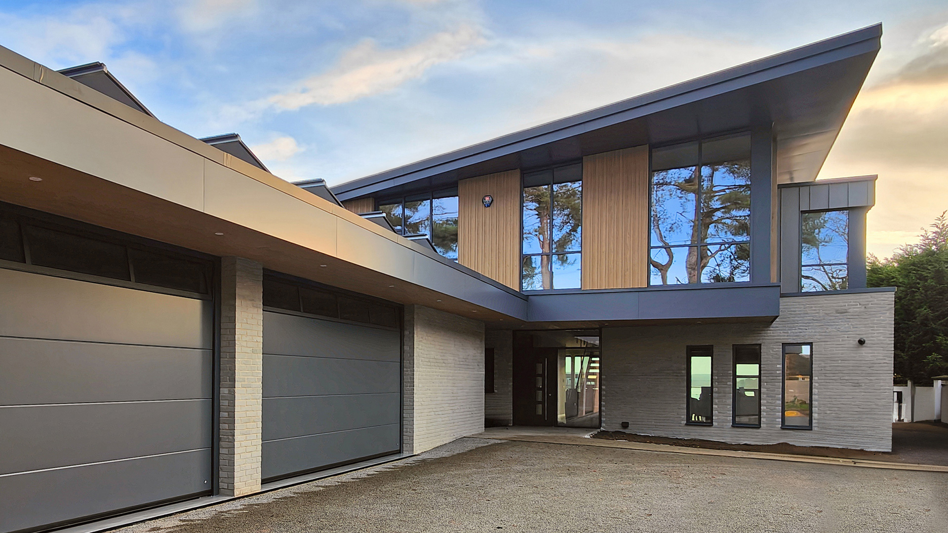 rear view of modern house with attached double garage